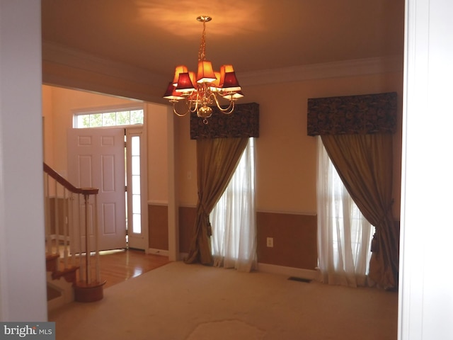 foyer featuring an inviting chandelier