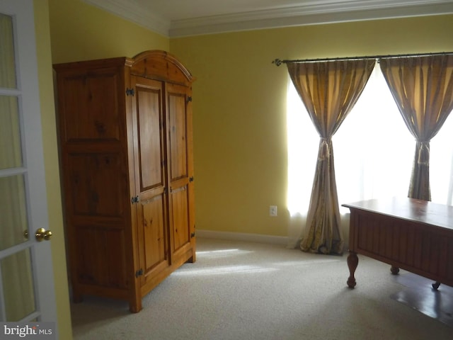 home office with light colored carpet and ornamental molding