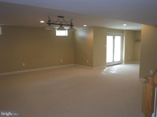 spare room with light colored carpet