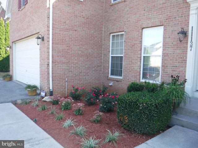 view of property exterior featuring a garage