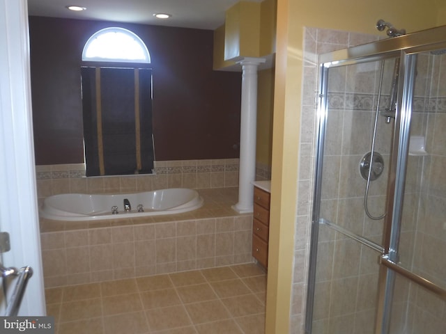 bathroom featuring tile patterned floors, ornate columns, vanity, and independent shower and bath