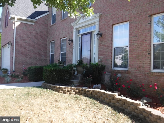 doorway to property featuring a garage