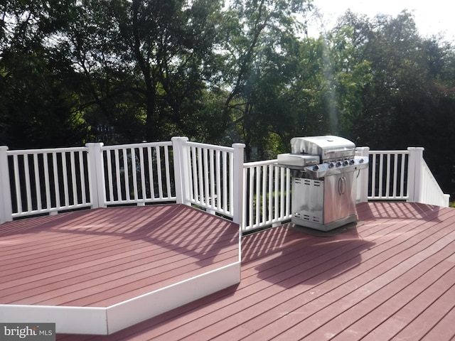 wooden deck featuring grilling area