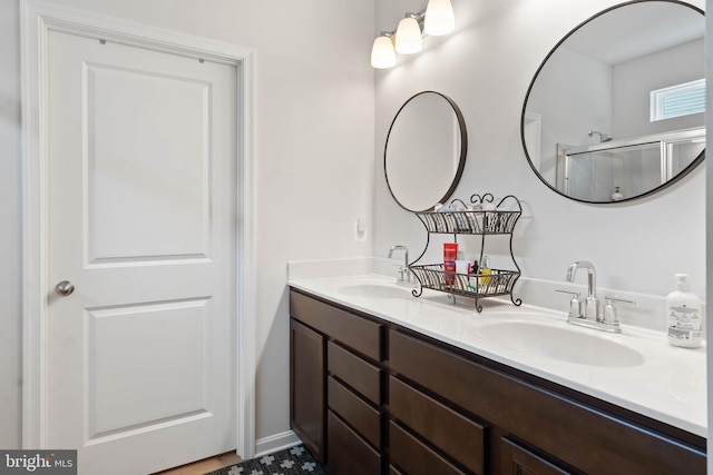 bathroom featuring dual vanity