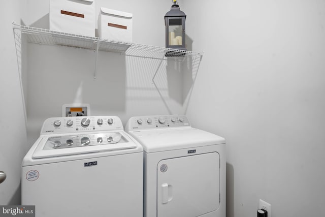 laundry area with washing machine and dryer