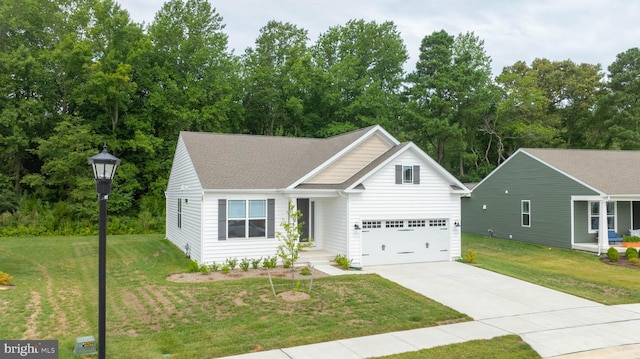 view of front of home with a garage and a front yard