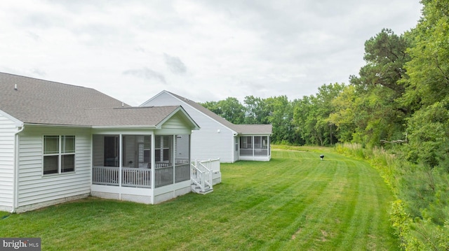 view of yard featuring a sunroom