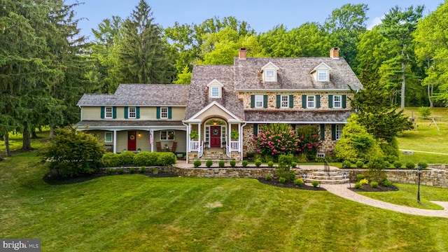 view of front of house featuring a front yard and a porch