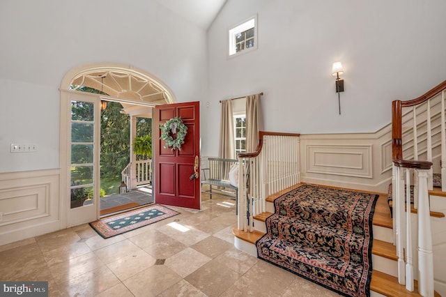 foyer entrance with a wealth of natural light and high vaulted ceiling