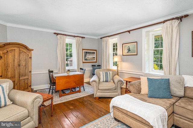 living room featuring hardwood / wood-style floors and crown molding