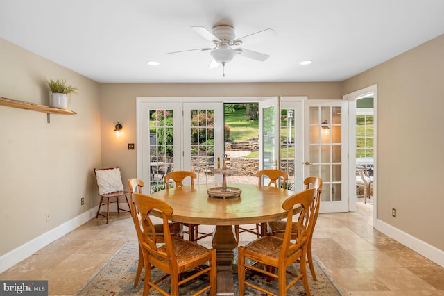 dining room with ceiling fan and french doors