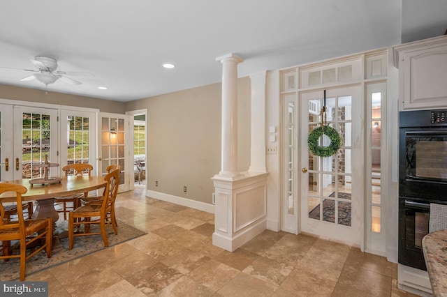 dining space featuring ceiling fan, french doors, and ornate columns