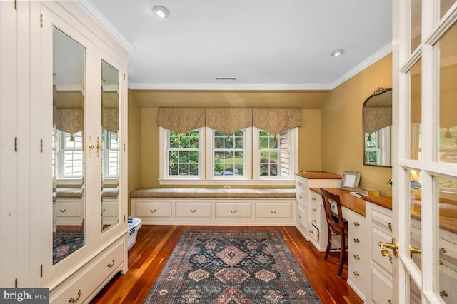 office area with dark wood-type flooring, plenty of natural light, and crown molding