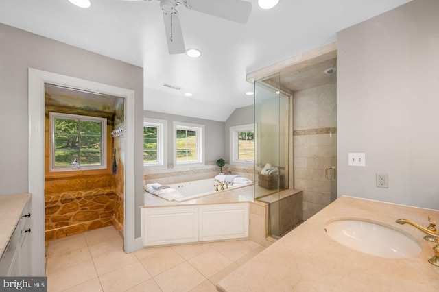 bathroom with ceiling fan, plus walk in shower, tile patterned flooring, lofted ceiling, and vanity