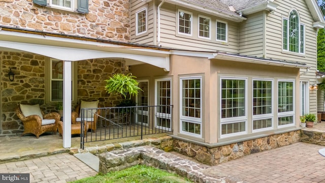 doorway to property with a patio