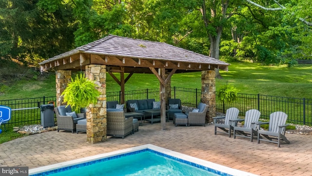 view of swimming pool with an outdoor hangout area, a gazebo, a patio area, and a yard