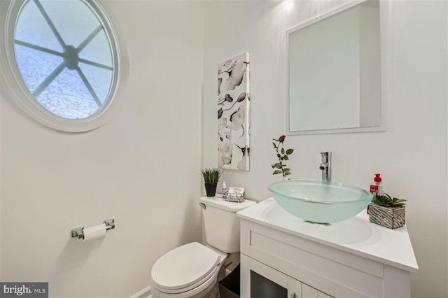 bathroom featuring vanity and toilet