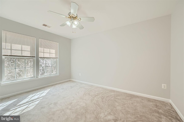 carpeted empty room with ceiling fan