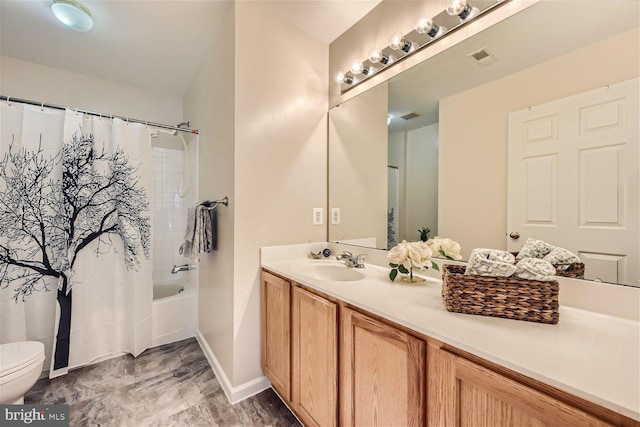 full bathroom featuring vanity, shower / tub combo, and toilet