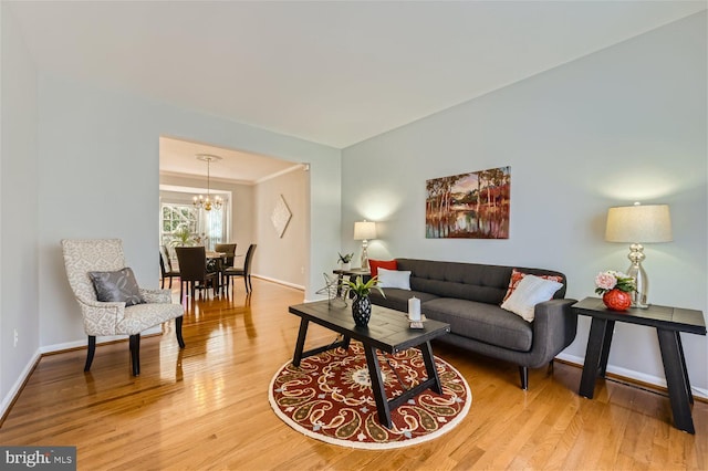 living room featuring hardwood / wood-style floors and a chandelier