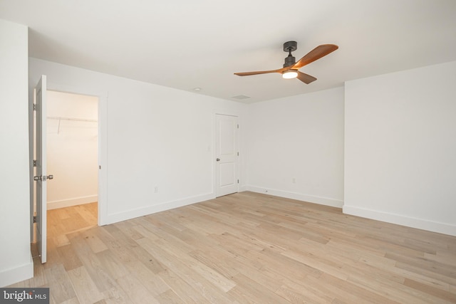 unfurnished room with ceiling fan and light hardwood / wood-style floors