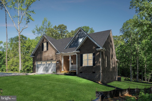 view of front of property featuring a front lawn and a garage