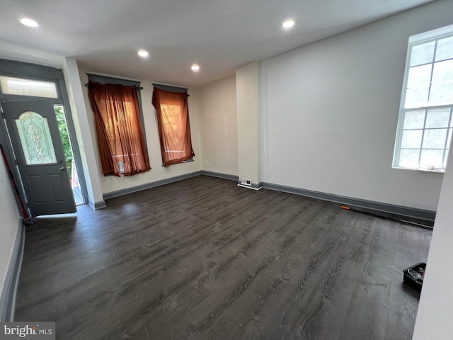 entryway with dark hardwood / wood-style floors