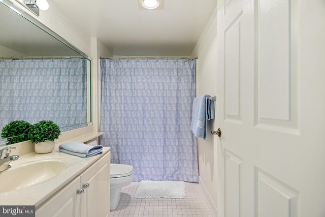 full bathroom featuring vanity, tile patterned flooring, and toilet