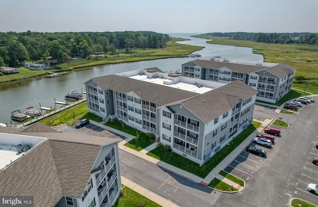 birds eye view of property with a water view