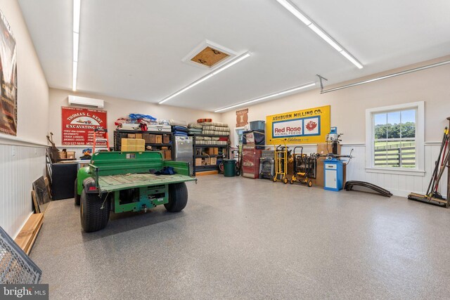 garage featuring a wall mounted AC