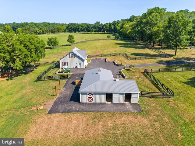 birds eye view of property with a rural view