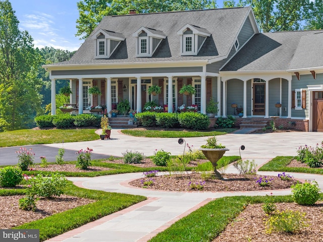 cape cod home with a porch