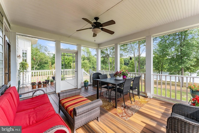 sunroom / solarium with ceiling fan