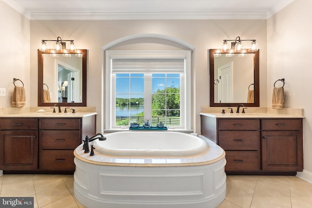 bathroom featuring vanity, a washtub, and tile patterned floors