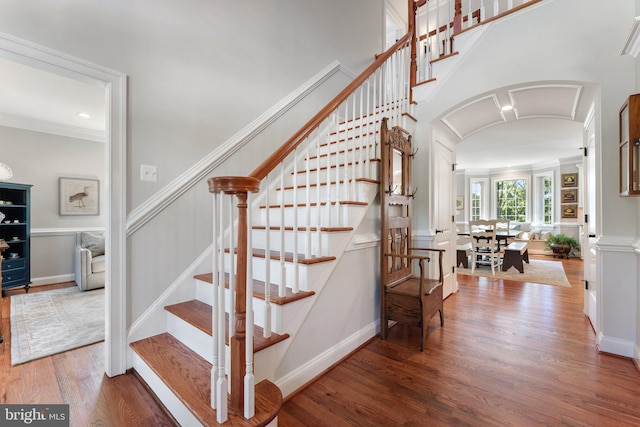 staircase featuring wood-type flooring