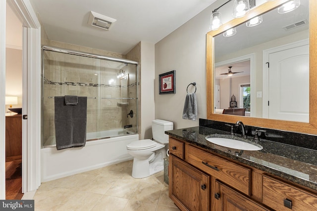 full bathroom featuring vanity, tile patterned floors, toilet, and combined bath / shower with glass door