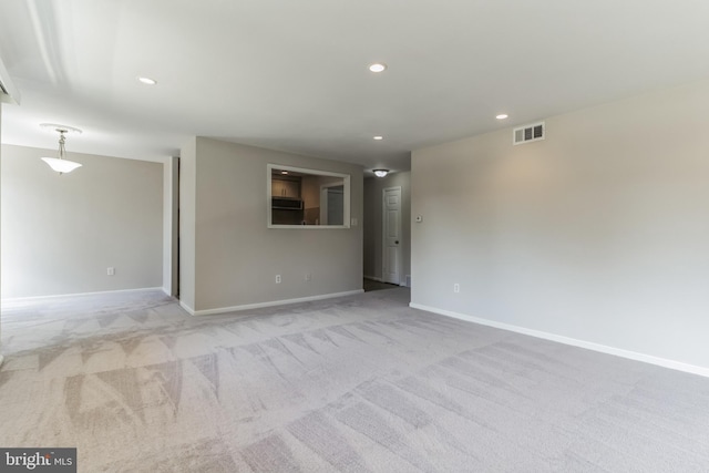 spare room with light colored carpet