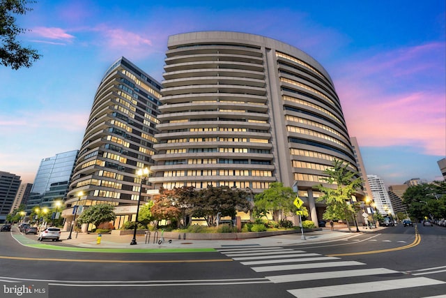 view of outdoor building at dusk