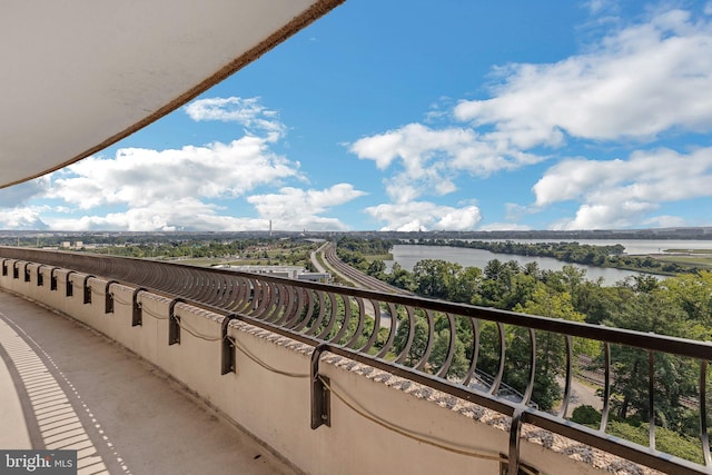 balcony featuring a water view