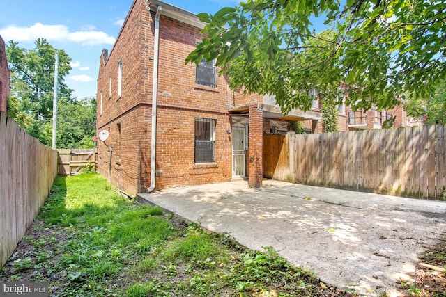 back of house with a patio