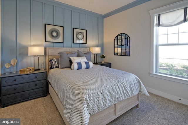 bedroom featuring crown molding and light carpet