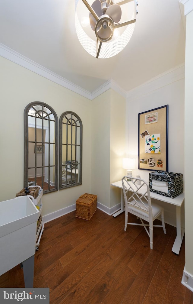 office space featuring ceiling fan, dark wood-type flooring, and ornamental molding