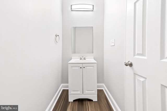 bathroom with vanity and wood-type flooring