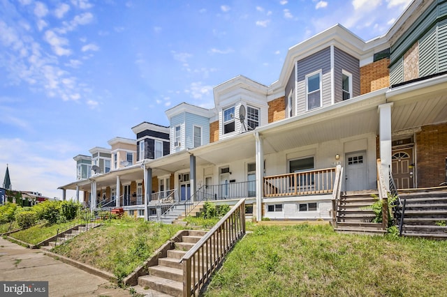 view of front of property featuring covered porch