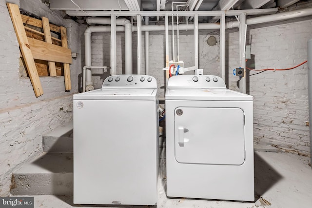 laundry room with washing machine and clothes dryer