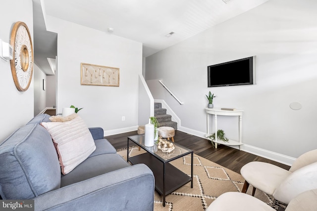 living room with dark hardwood / wood-style flooring