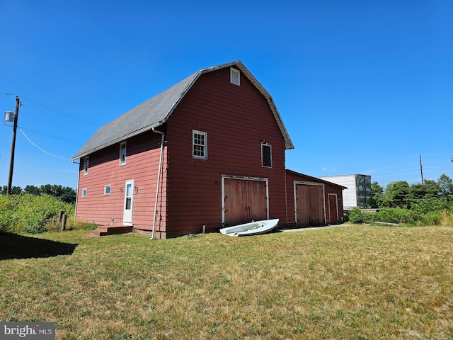 view of property exterior with a yard