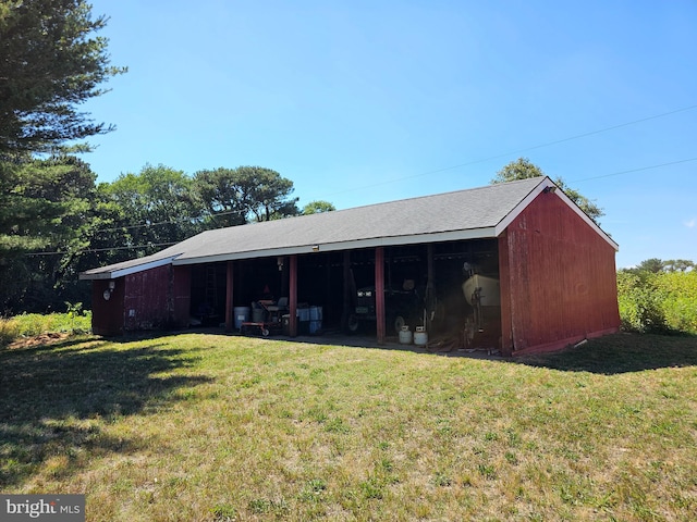 view of outbuilding with a lawn