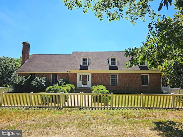 new england style home with a front yard