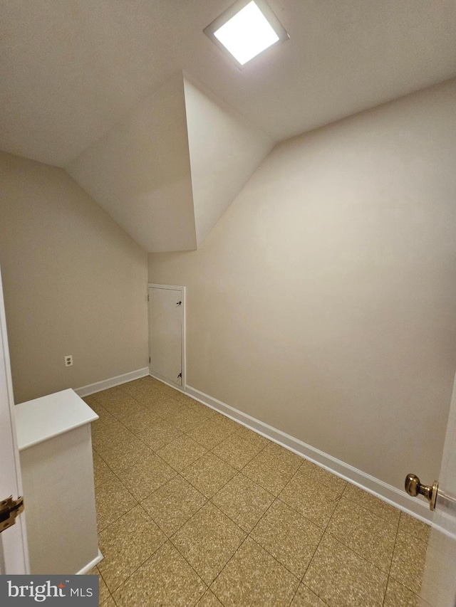 additional living space featuring vaulted ceiling